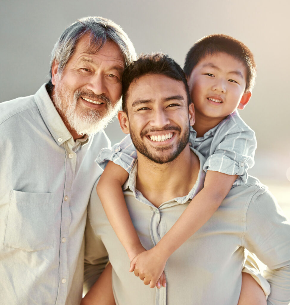 A grandfather, father, and son together